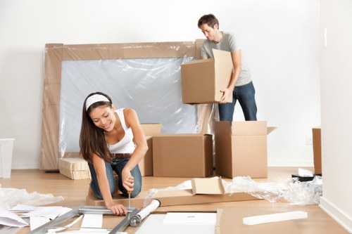 Removal van and moving team in Golders Green residential street