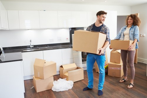 Removal team loading household boxes in Golders Green